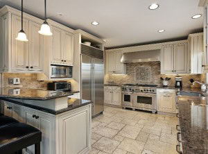 A kitchen home remodel in San Jose by BridgeView Construction - Bridgeview Construction a kitchen with white cabinets and stainless steel appliances